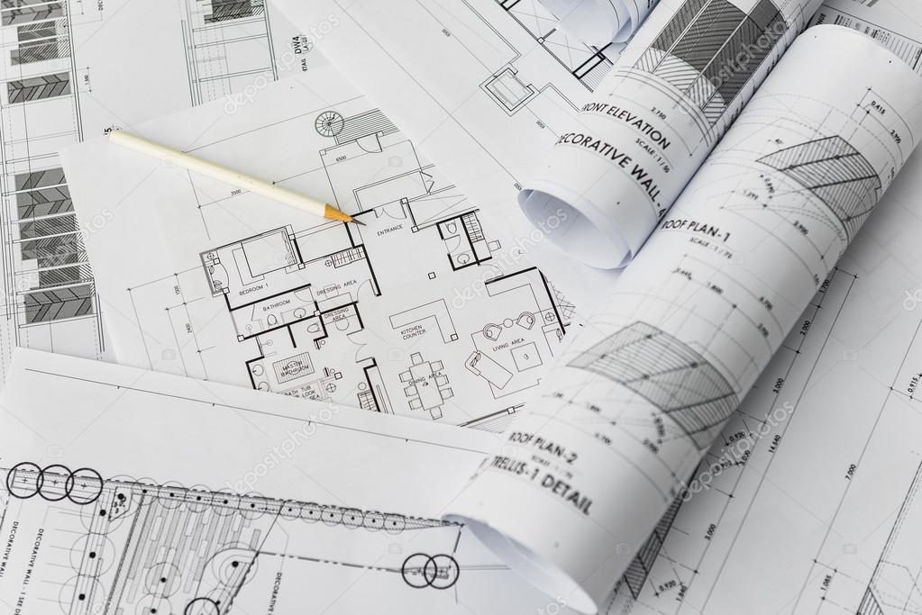 depositphotos_90675080-stock-photo-white-pencil-on-architectural-for